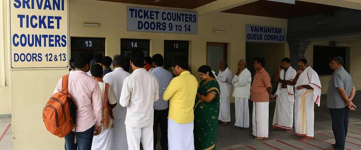 Srivani darshan ticket counters at Tirumala with devotees waiting