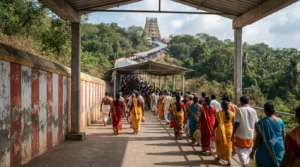 Roja Selvamani Tirumala visit context: pilgrims in the covered TTD darshan queue approach at Tirumala