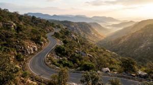 Getaways near Tirupati: a winding ghat road climbing through forested Eastern Ghats hills at sunrise