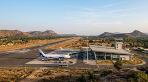 Tirupati Airport terminal and runway at Renigunta with forested hills in the background